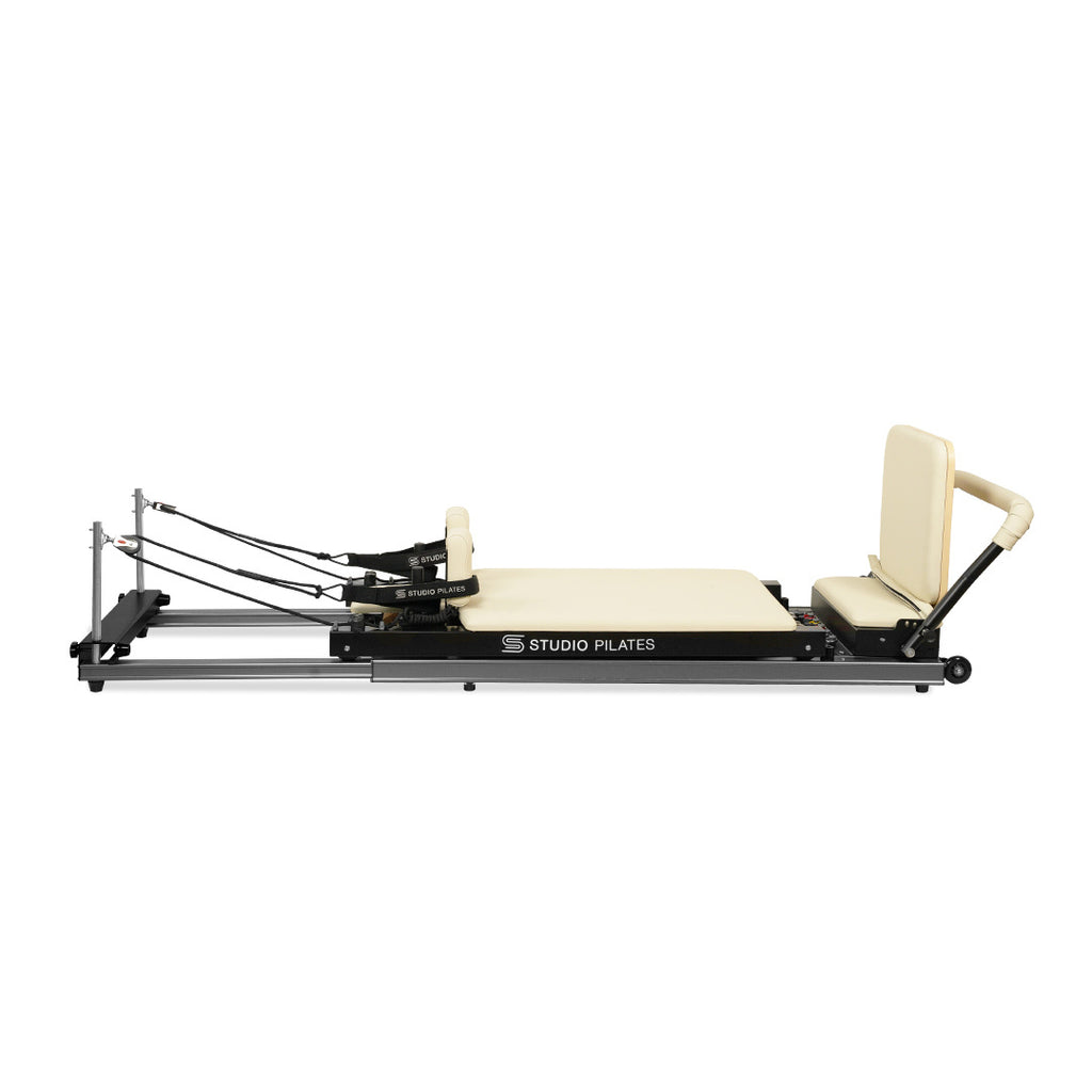 Pilates reformer machine on a white background