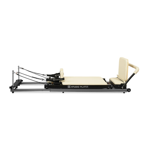 Pilates reformer machine on a white background