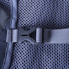 Close-up of a gray backpack strap with a buckle on a textured fabric background