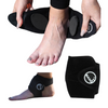 Black ankle support brace being worn on a foot with a white background