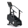 Step machine with digital display on a white background