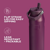 Purple water bottle with flip straw lid on a purple background