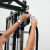 Person using a pull-up bar on a fitness equipment with a white background
