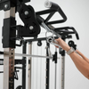 Person adjusting a gym machine with a focus on the hand and equipment.